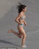 22810876-7838191-Pippa_seemed_delighted_as_she_rushed_to_the_waves_for_a_swim_in_-a-24_1577738...jpg