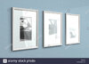 una-secuencia-de-tres-fotografias-colgadas-enmarcada-en-una-pared-azul-plana-en-una-casa-con-p...jpg