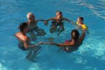 127032749-5-people-swim-in-the-pool-forming-a-circle-people-in-the-water-holding-hands.jpg