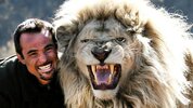 The Lion Whisperer Kevin Richardson with one of his male lions in South Africa.jpg