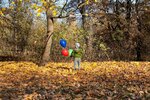 boy-holding-three-balloons-with-helium_252085-6923.jpg