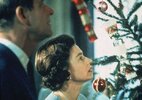 Queen Elizabeth II and Prince Philip look at their decorated Christmas tree.jpg