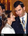 spanish-prince-felipe-r-listens-to-his-fiancee-letizia-ortiz-during-a-ceremony-at-parliament-i...jpg