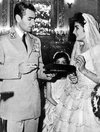 The Shah of Iran with his eldest daughter, Shahnaz on her wedding day 1957.jpg