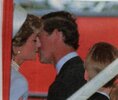 Prince Charles gives Princess Diana a kiss  1997.jpg