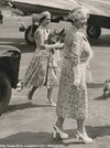 Princess Margaret carries a corgi, 1956-.jpg