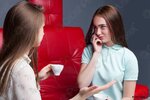 two-girls-drinking-coffee-gossiping-1431628.jpg