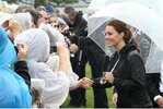 catherine_duchess_of_cambridge_shakes_hands_after_dragon_boat_race.jpg